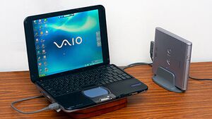 Sony VAIO SRX next to its CD-ROM Drive